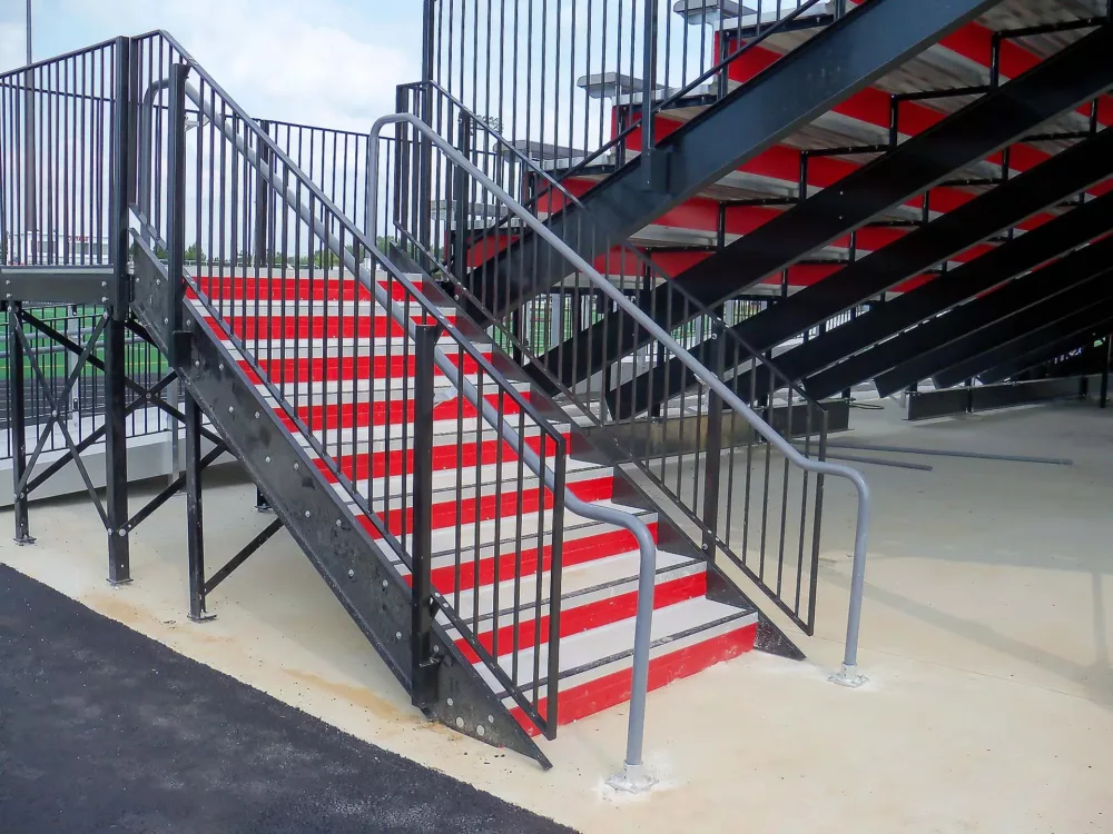 Aluminum rail enclosing the entrance of a grandstand.