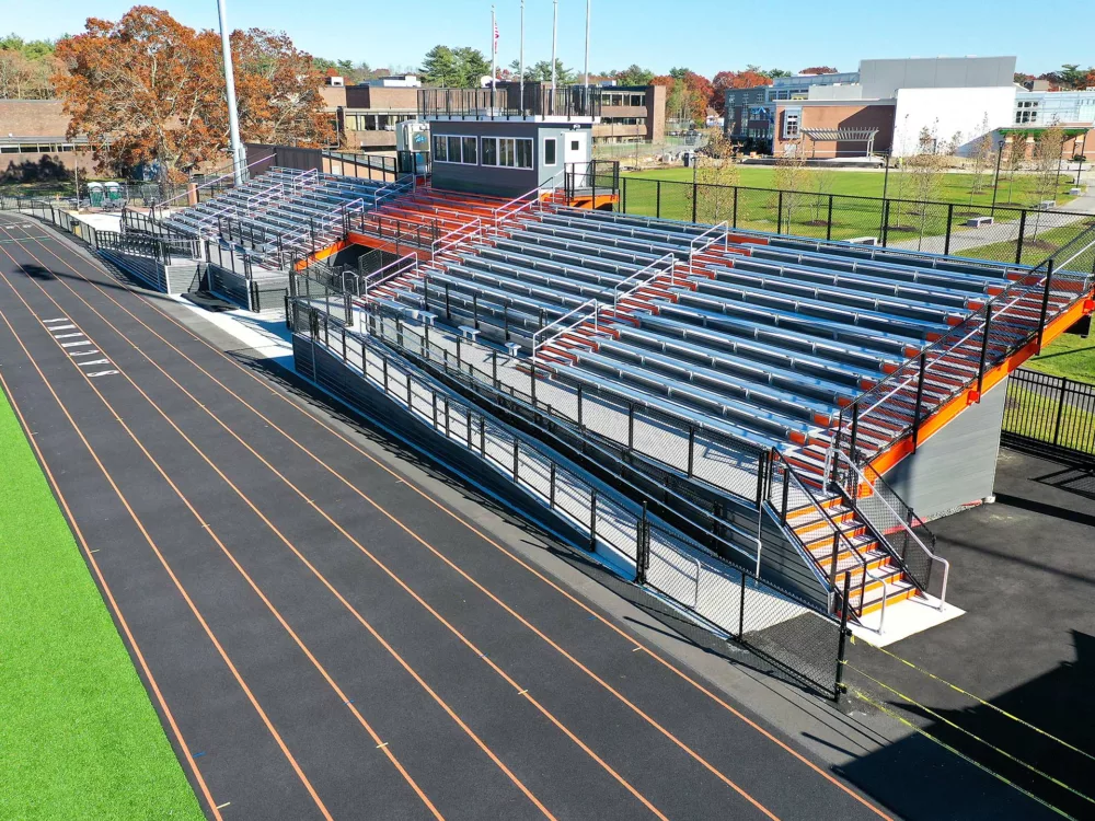 Full stadium system view, including a large grandstand and press box.