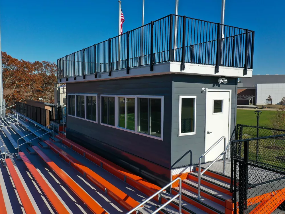 Side view of press box, highlighting press box design.