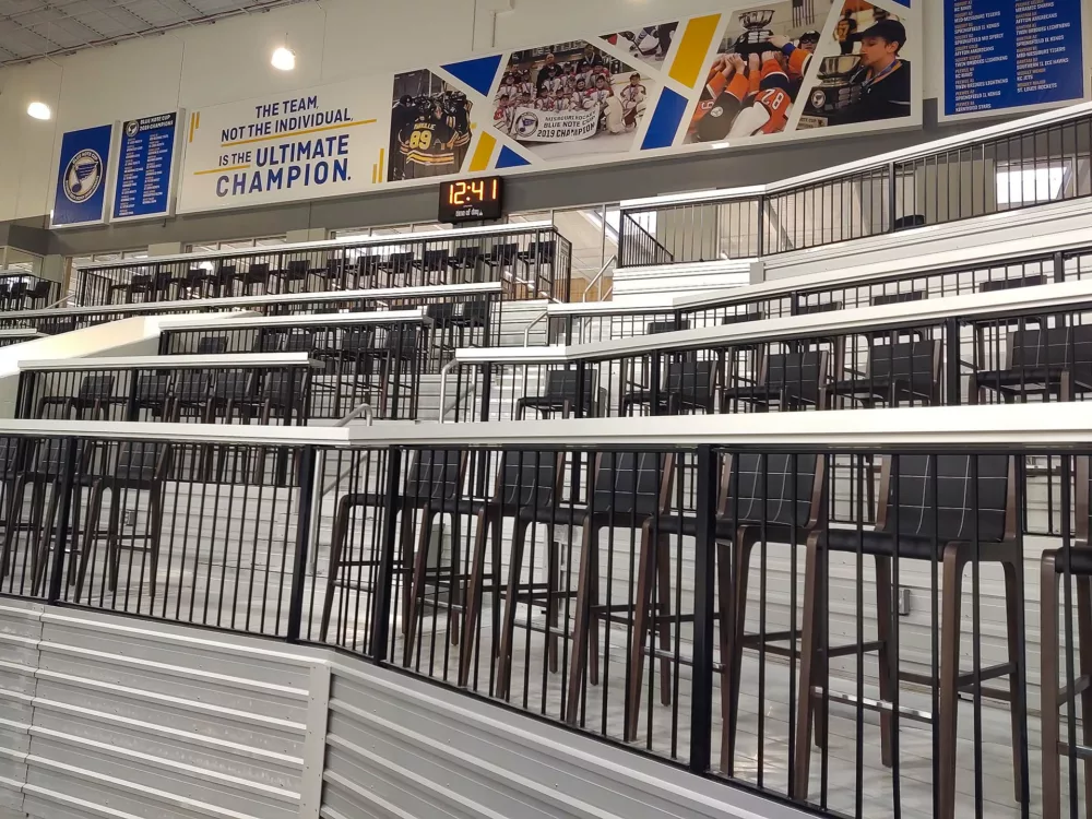 Aluminum railing on top of an aluminum closure panel.