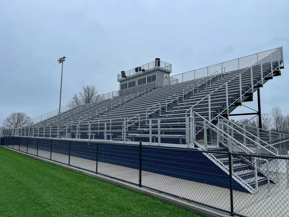 Aluminum stadium seats, complete with a press box and aluminum rail.