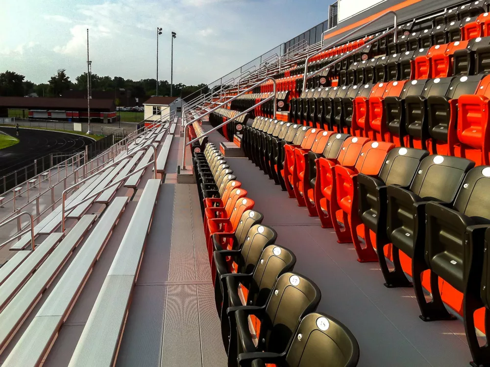 Bleacher seats with backs and aluminum benches.