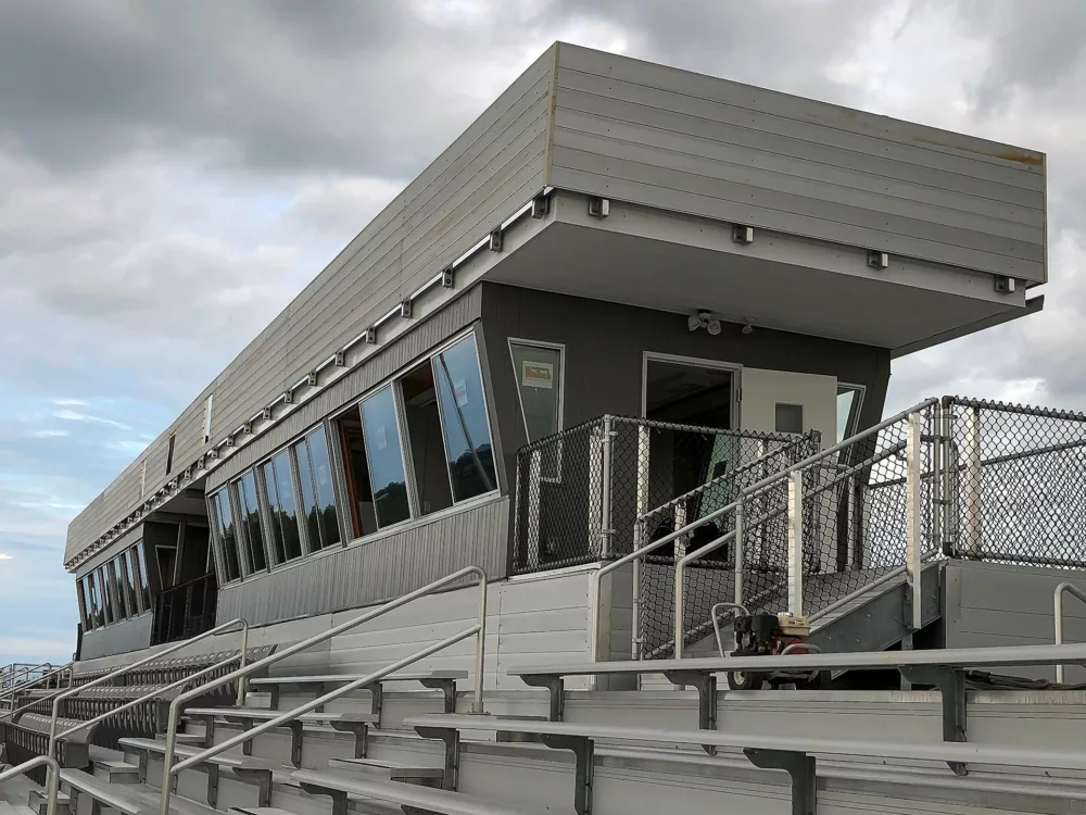 Side-view of press box, complete with aluminum rail.