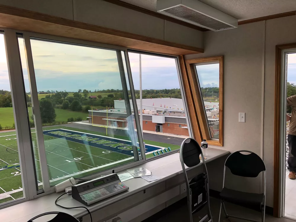 Alternate view of football field from inside a press box.