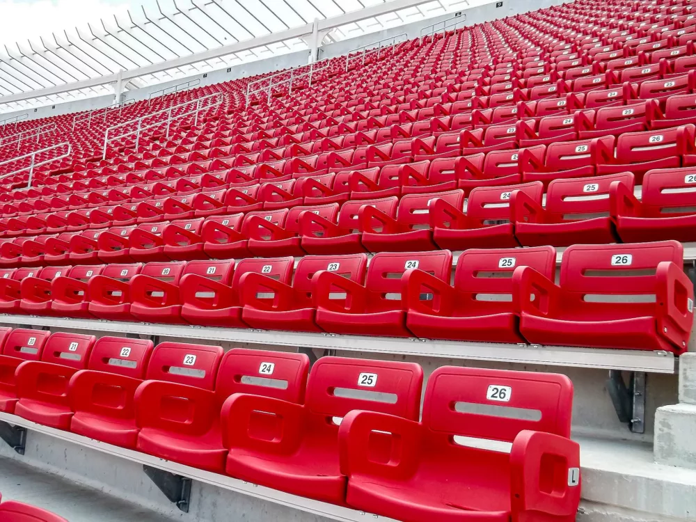 Close-up view of Stadium seats with backs.