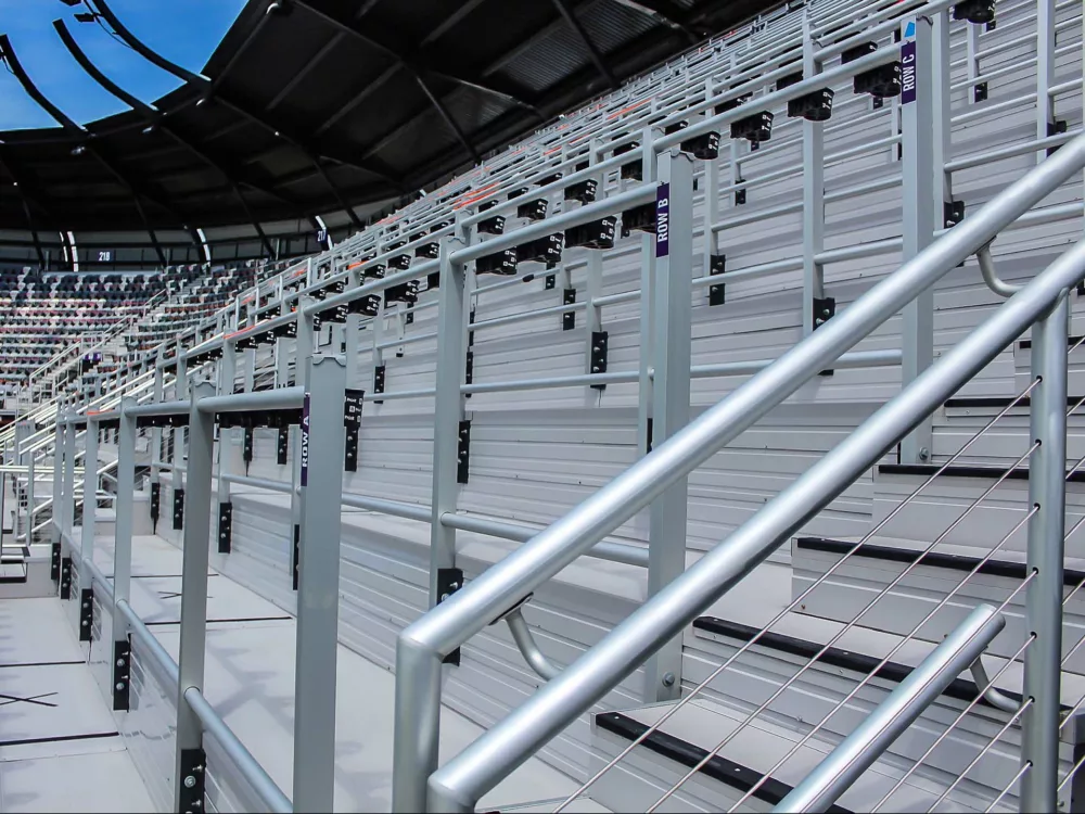 Safe standing aluminum rail system at Lynn Family Stadium.