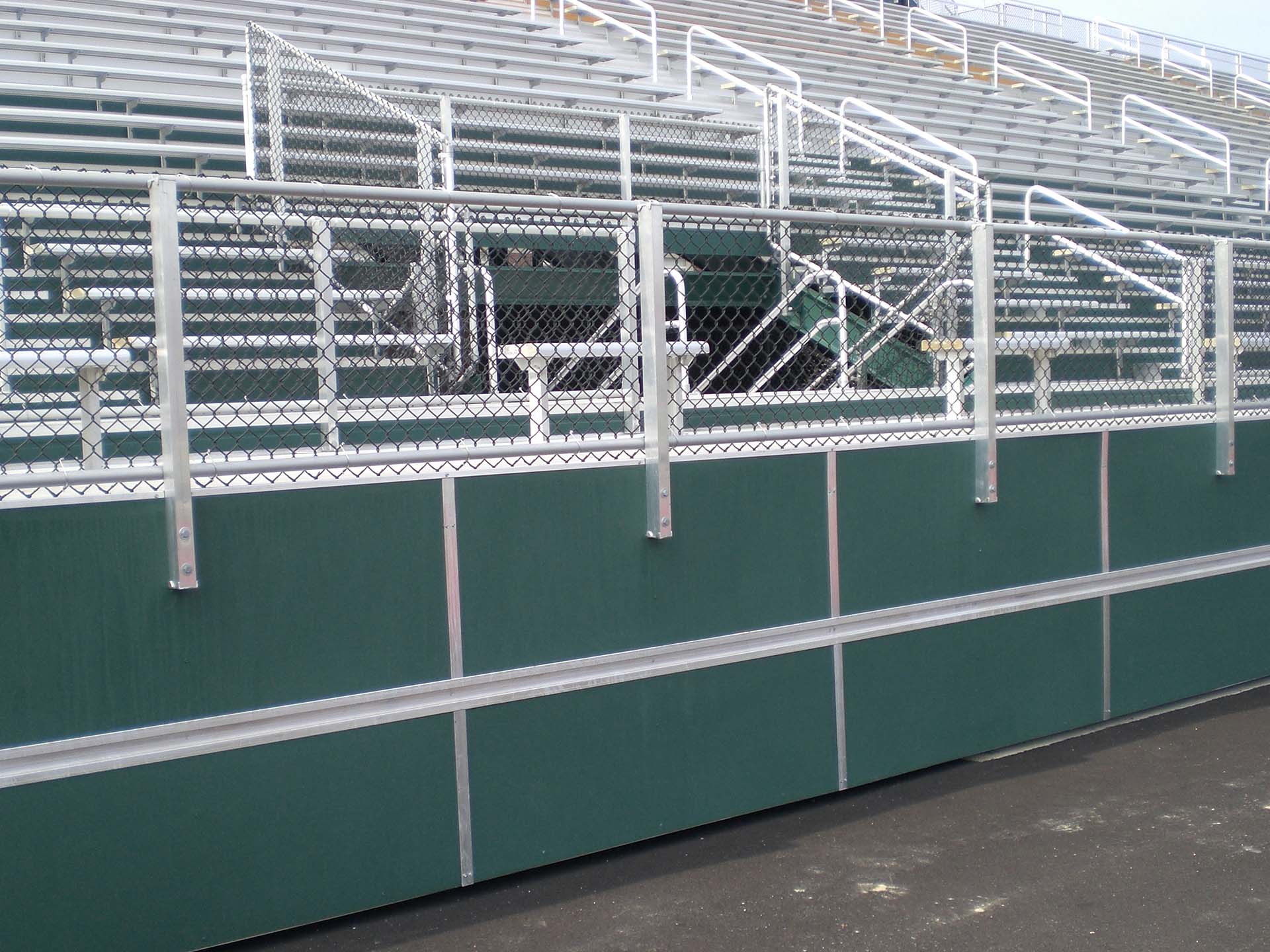 Closure panels created by Dant Clayton enclose the areas around a grandstand.