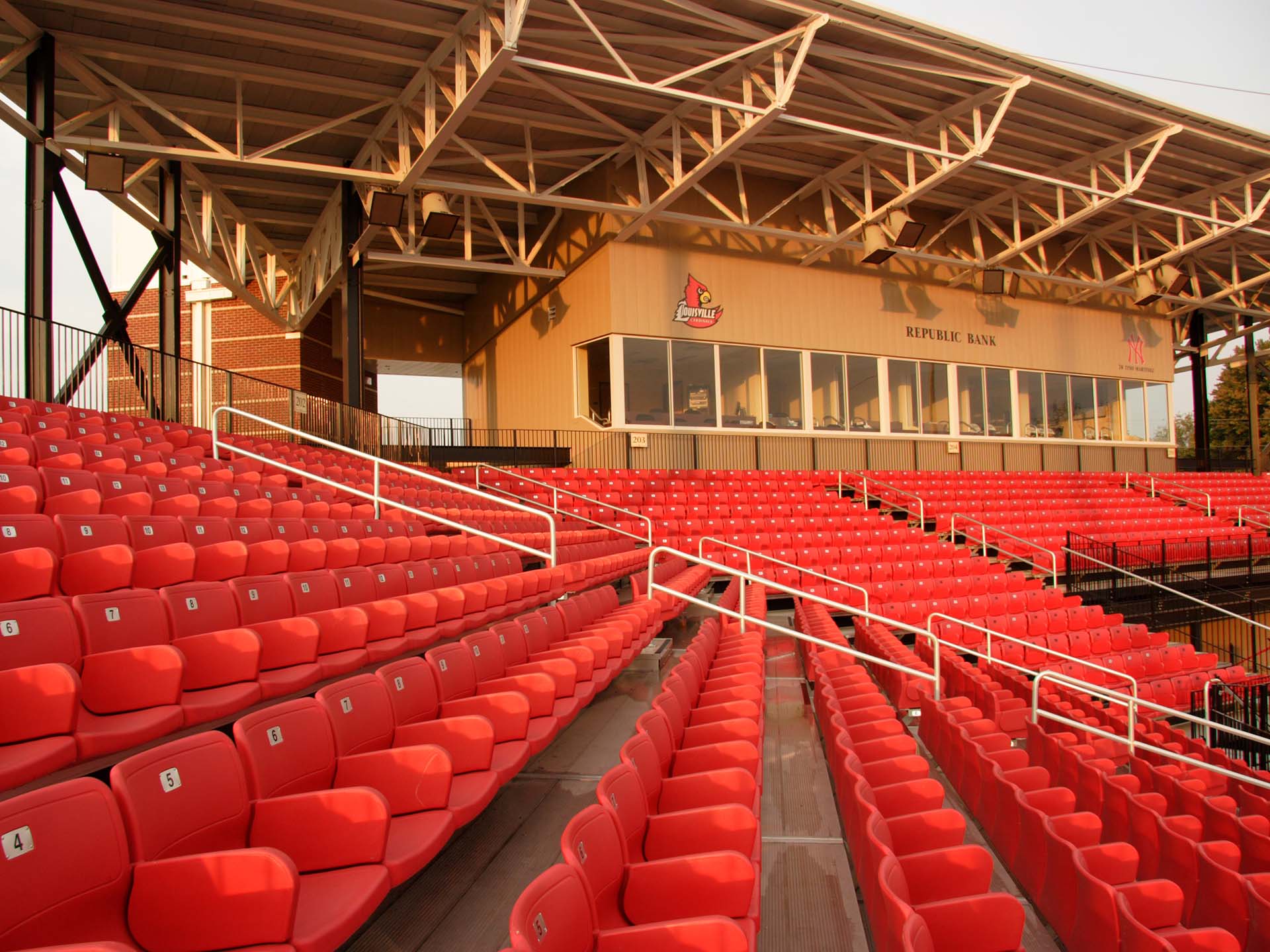Stadium seats with backs.