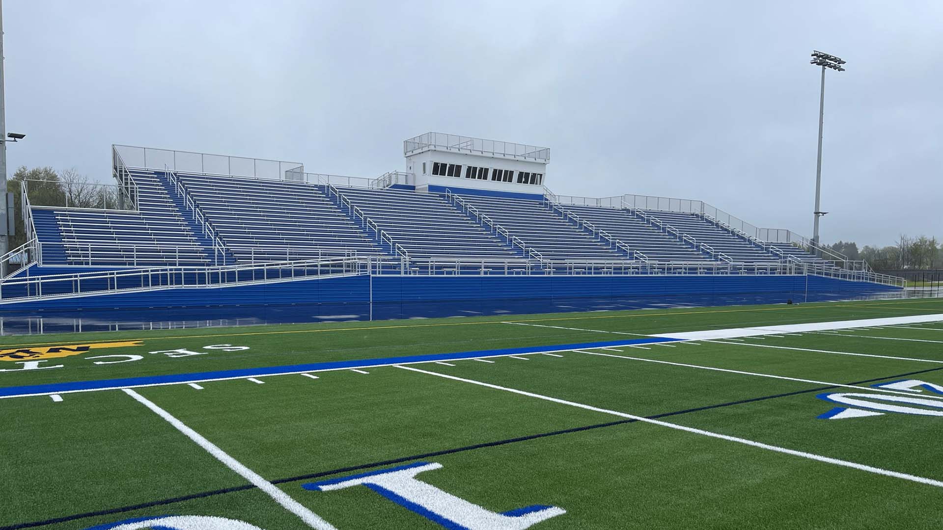 Horseheads High School grandstand, with aluminum bench seating and a press box.