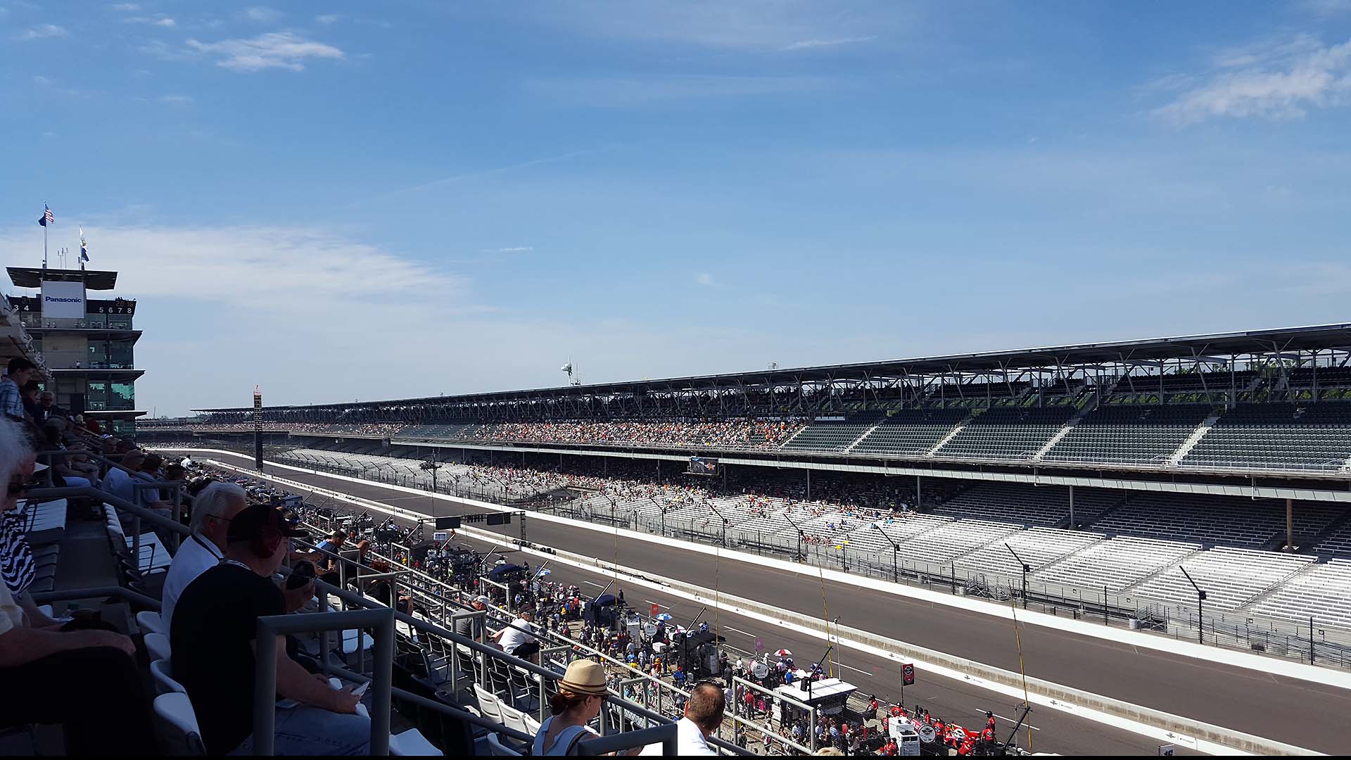 The half-filled grandstands at Indianapolis Motor Speedway, complete with aluminum bench seating.