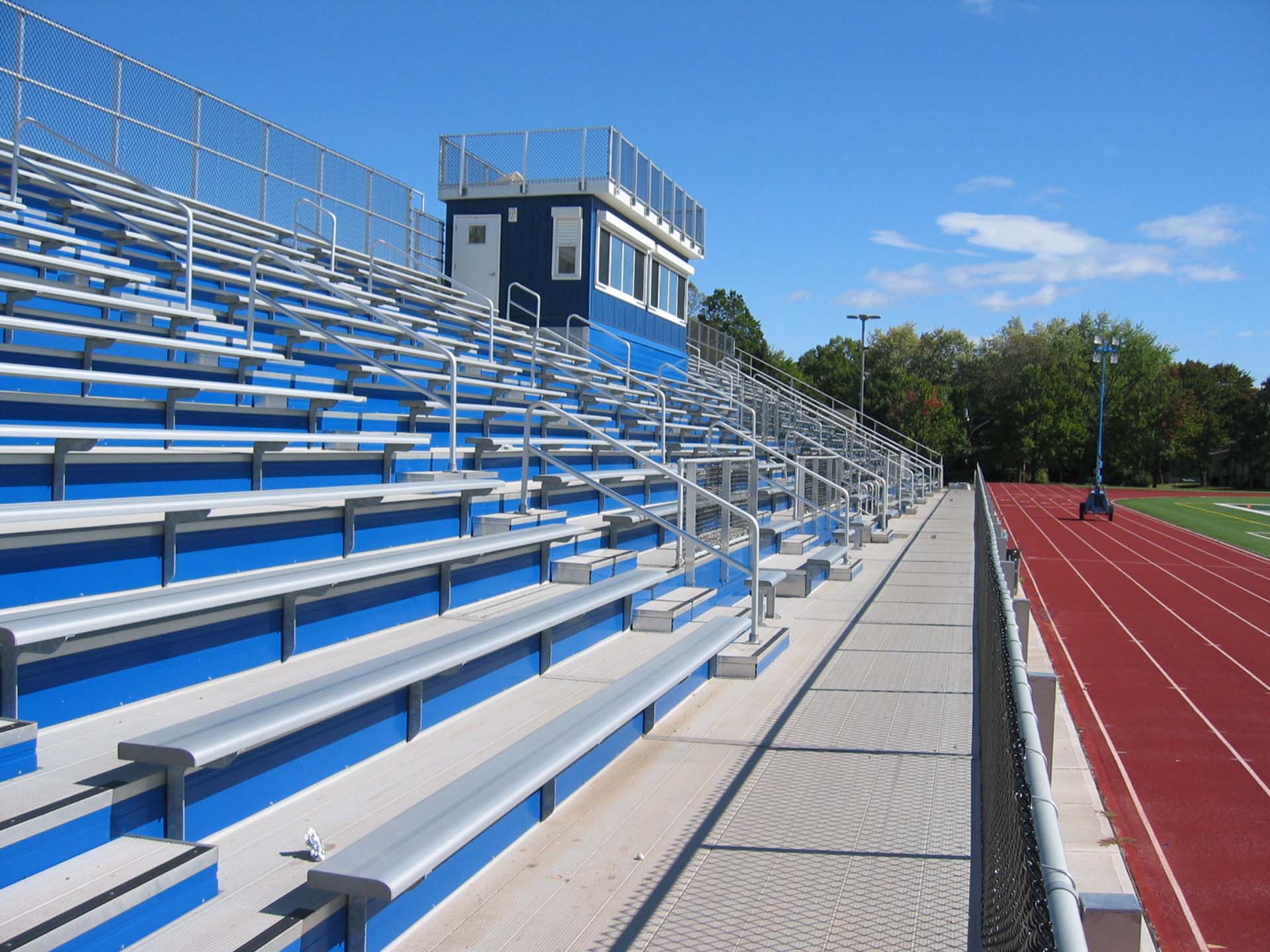 Custom bleacher seats and aluminum rail.