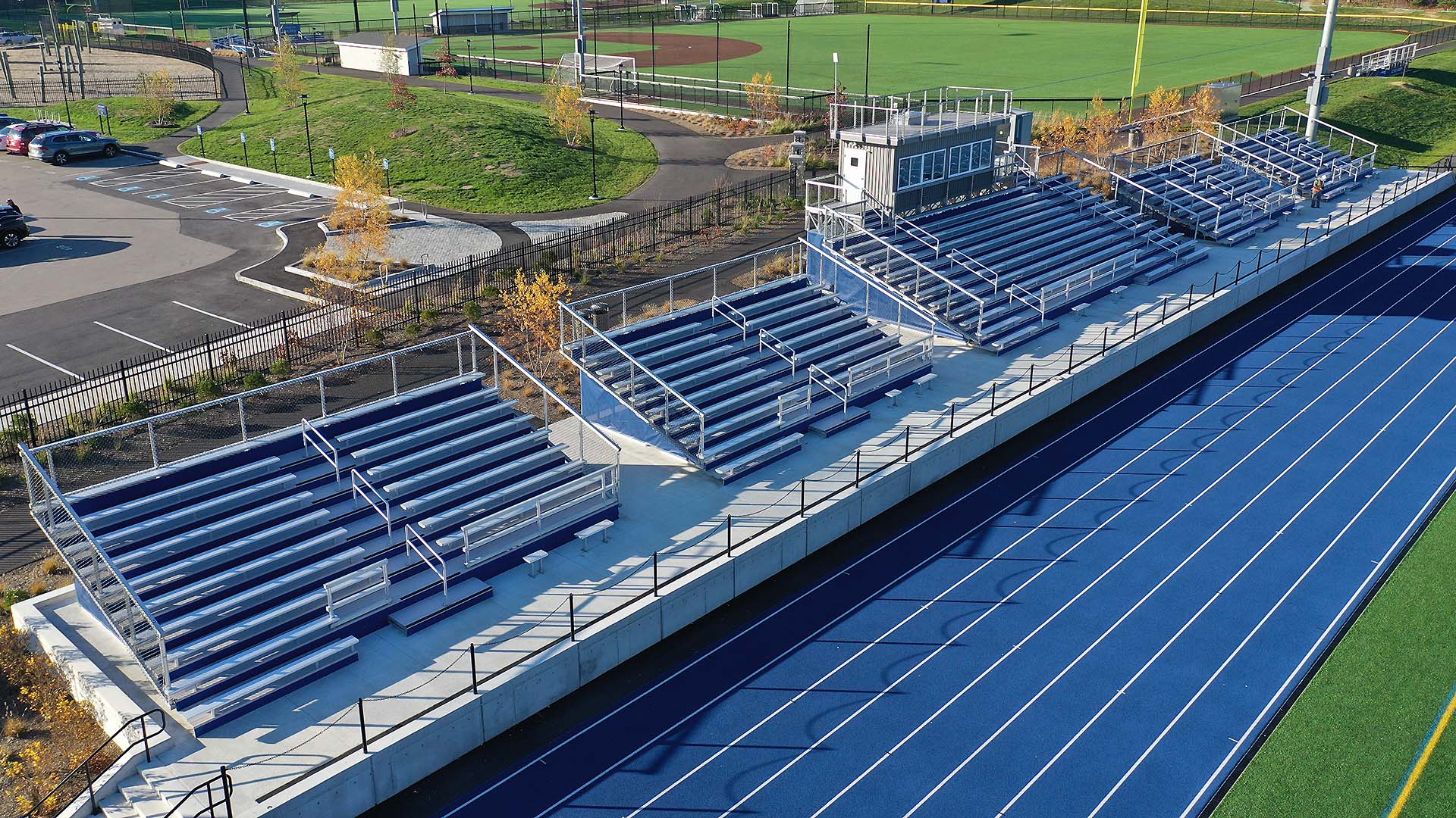 Seat solutions for a field in Scituate, MA: featuring aluminum bleachers and aluminum rail.