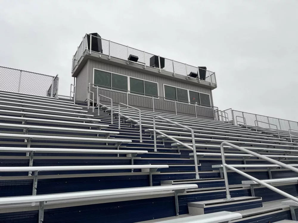 A close up of the press box installation on a Game Ready Grandstand structure.