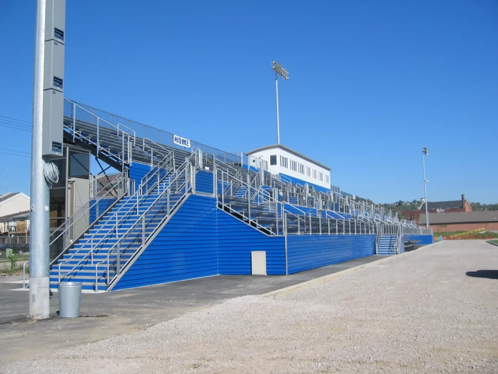 I-beam grandstand with blue aluminum riser closure and press box