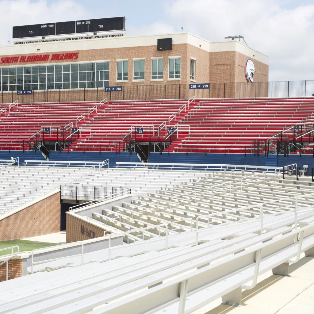 Stadium system view of Hancock Whitney Stadium. Focused on I-Beam grandstands and stadium seats.