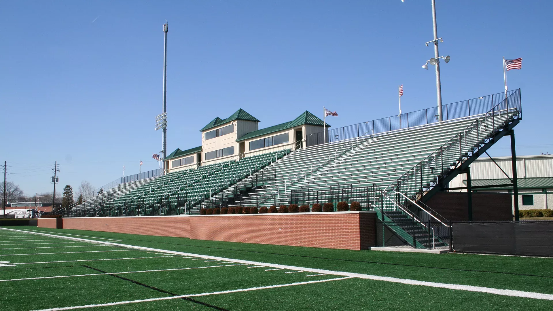 Grandstand and press box at Marshall Stadium - finished with aluminum bench seating.