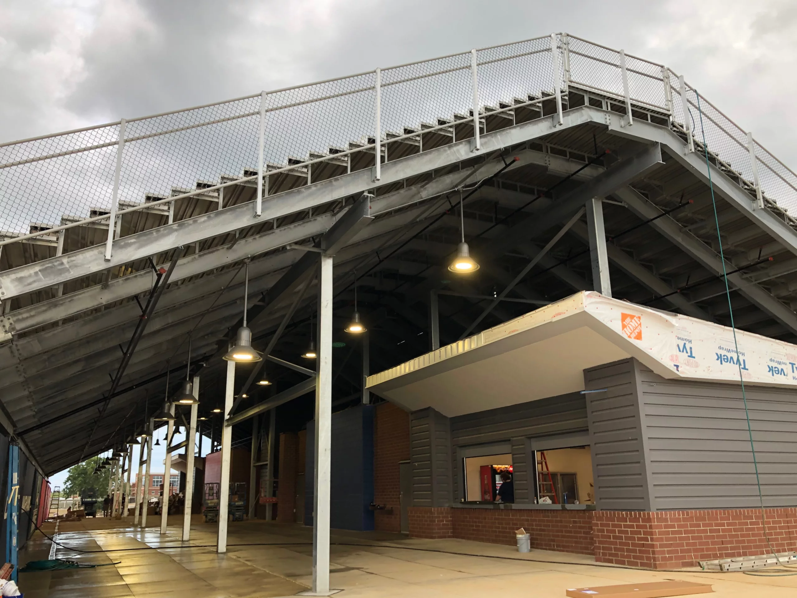 back to back I-beam grandstand offering seating for two fields with concession stands underneath